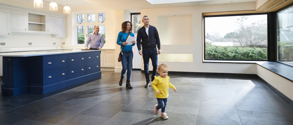 a family looking at a new home through an open house event