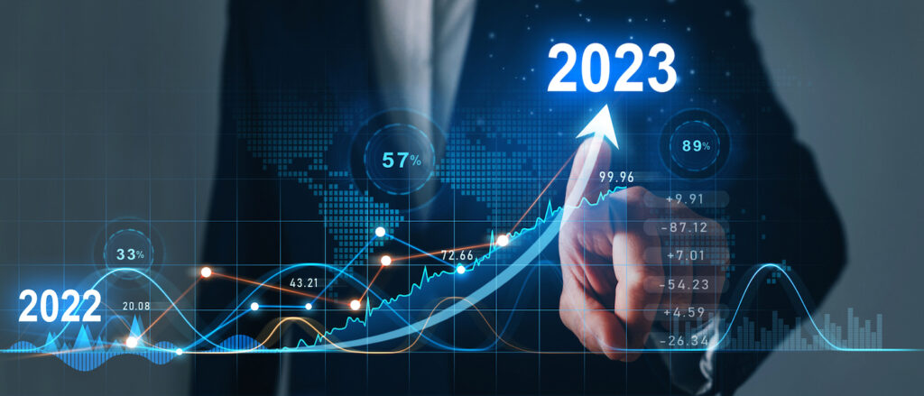 Businessman draws increase arrow graph corporate future growth year 2022 to 2023.