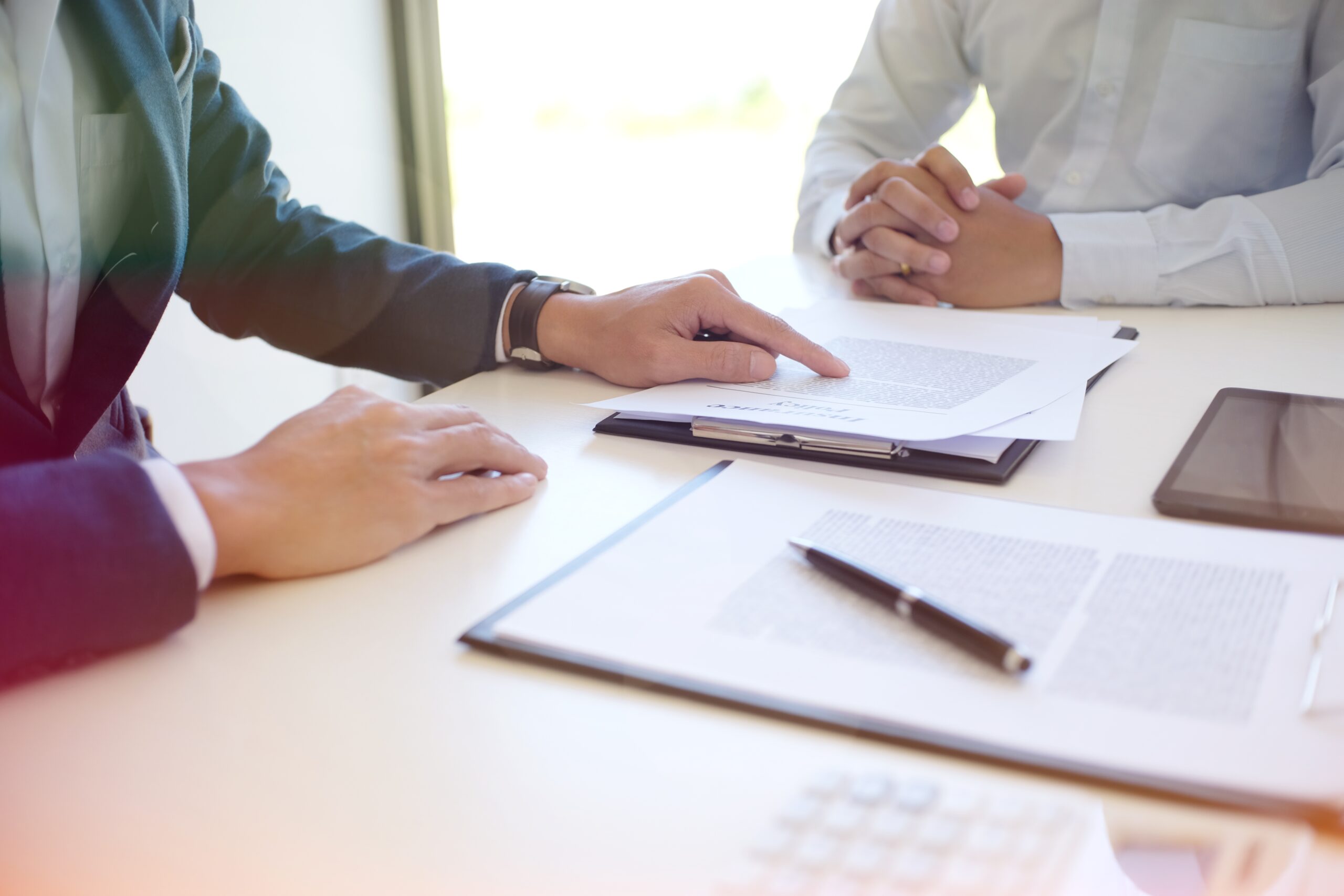 Sales manager giving advice application form document, considering mortgage loan offer for car insurance