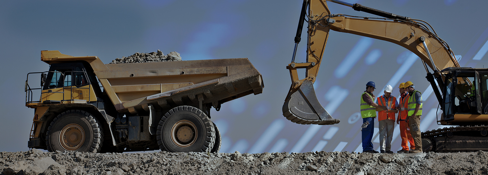 Construction equipment on hill with workers talking