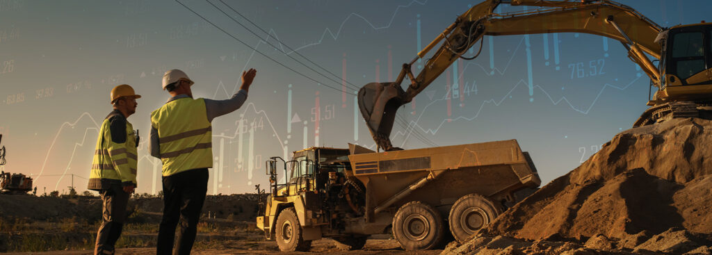 construction workers looking at equipment with data overlay