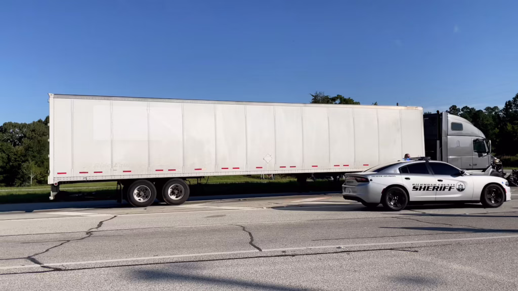sheriff pulling over semi truck
