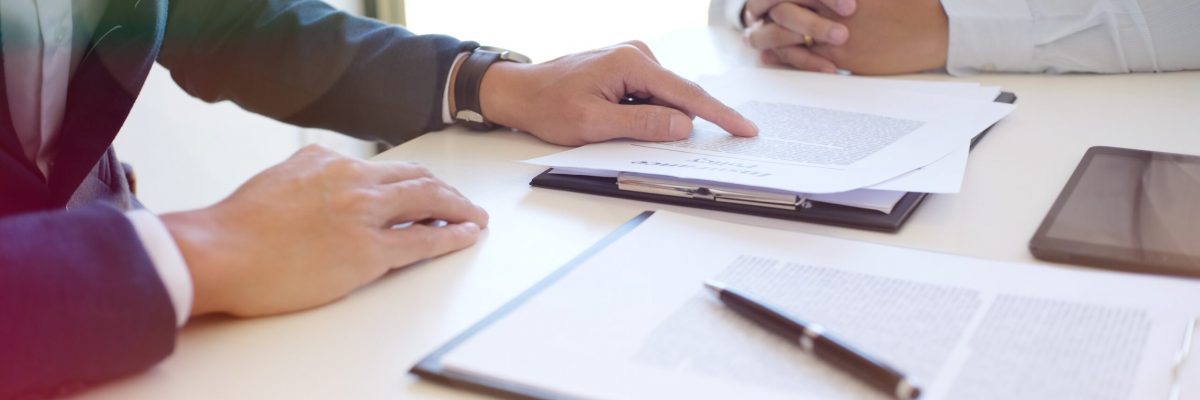 Sales manager giving advice application form document, considering mortgage loan offer for car insurance
